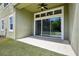 Covered patio featuring a ceiling fan and views of the green backyard at 8420 Corkfield Ave, Orlando, FL 32832