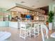 Stylish bar area with modern seating, clean countertops, and contemporary design at 8943 Coconut Breeze Dr, Kissimmee, FL 34747