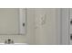 Bright bathroom featuring a large mirror, sink, and white walls at 8943 Coconut Breeze Dr, Kissimmee, FL 34747