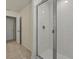 Clean bathroom featuring a walk-in shower with glass enclosure and tiled walls at 8943 Coconut Breeze Dr, Kissimmee, FL 34747