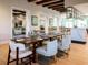 Tastefully designed dining room with a large table, comfortable seating, and elegant decor at 8943 Coconut Breeze Dr, Kissimmee, FL 34747