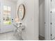 Bright and welcoming foyer with a stylish mirror and console table, leading into the home's interior at 8943 Coconut Breeze Dr, Kissimmee, FL 34747