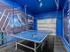 Fun game room featuring ping pong table with an epic outer space mural on the wall at 8943 Coconut Breeze Dr, Kissimmee, FL 34747