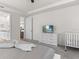 Bright bedroom featuring a dresser with a TV on it, and a crib at 8943 Coconut Breeze Dr, Kissimmee, FL 34747