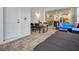 Relaxing outdoor patio featuring stone floors, dining table, lounge seating, and sliding glass doors at 8943 Coconut Breeze Dr, Kissimmee, FL 34747