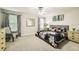 Spacious bedroom with a floral patterned comforter and lots of natural light at 8989 Cuban Palm Rd, Kissimmee, FL 34747