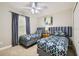 Cozy bedroom with two twin beds, plush carpeting, and neutral walls at 8989 Cuban Palm Rd, Kissimmee, FL 34747