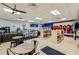 Interior of a convenience store with shelves, displays, and seating area for a quick stop for refreshments and snacks at 8989 Cuban Palm Rd, Kissimmee, FL 34747