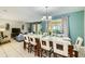 Expansive dining area open to the living room, filled with natural light and stylish decor at 8989 Cuban Palm Rd, Kissimmee, FL 34747