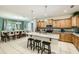 Well-appointed kitchen and dining area with stainless steel appliances and granite countertops at 8989 Cuban Palm Rd, Kissimmee, FL 34747