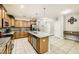 Bright kitchen features stainless appliances, granite countertops, and tile flooring at 8989 Cuban Palm Rd, Kissimmee, FL 34747