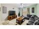 Comfortable living room with ample seating and a modern entertainment center at 8989 Cuban Palm Rd, Kissimmee, FL 34747