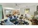 Open concept living room featuring a spacious floor plan, modern furnishings, and bright, neutral paint at 8989 Cuban Palm Rd, Kissimmee, FL 34747