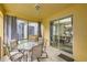 Inviting outdoor patio with comfortable seating, perfect for relaxing or entertaining guests overlooking interior dining area at 8989 Cuban Palm Rd, Kissimmee, FL 34747
