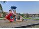 Community playground with slides, climbing structures, and soft landing surface for enjoyment and safety at 8989 Cuban Palm Rd, Kissimmee, FL 34747