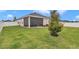 The backyard features a well-maintained lawn, screened patio and privacy fence at 9262 Sw 58Th Cir, Ocala, FL 34476