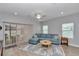 Bright and airy living room with a comfortable sectional sofa and access to the outdoor patio at 9262 Sw 58Th Cir, Ocala, FL 34476