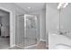 Main bathroom with a sleek glass-enclosed shower, double sinks, and modern fixtures at 9262 Sw 58Th Cir, Ocala, FL 34476