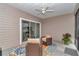 Comfortable screened patio area with patio furniture and sliding glass doors to the living room at 9262 Sw 58Th Cir, Ocala, FL 34476