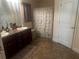 A bathroom featuring double sinks and a shower with shower curtain at 1185 Sabine Ln, Kissimmee, FL 34759