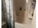 Clean bathroom featuring a bathtub with shower combination and soft lighting at 1185 Sabine Ln, Kissimmee, FL 34759