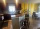 Stylish kitchen with breakfast bar and adjacent dining area, perfect for entertaining at 1185 Sabine Ln, Kissimmee, FL 34759