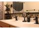 Bathroom features a dual sink vanity with matte black fixtures and decor at 1009 Ronlin St, Haines City, FL 33844
