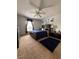 Cozy bedroom features natural light, ceiling fan, neutral paint, and carpet at 1009 Ronlin St, Haines City, FL 33844