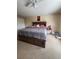Bedroom with carpet, ceiling fan, natural light, and neutral walls at 1009 Ronlin St, Haines City, FL 33844