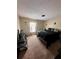 Spacious bedroom with window, ceiling fan, and carpeted floors at 1009 Ronlin St, Haines City, FL 33844