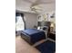 Cozy bedroom features natural light, ceiling fan, neutral paint, and carpet at 1009 Ronlin St, Haines City, FL 33844