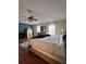 Comfortable main bedroom featuring a wood floor, a ceiling fan, and neutral paint at 1009 Ronlin St, Haines City, FL 33844