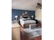 Comfortable main bedroom featuring a wood floor, a ceiling fan, and neutral paint at 1009 Ronlin St, Haines City, FL 33844