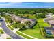 An aerial view of the home, showcasing lush landscaping, large lawns, and a screen enclosed pool at 10160 Mallard Landings Way, Orlando, FL 32832