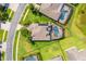 Bird's eye view of house showing the pool and lanai with solar panels on the roof at 10160 Mallard Landings Way, Orlando, FL 32832
