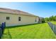 Large fenced backyard with lawn and screened patio at 10160 Mallard Landings Way, Orlando, FL 32832