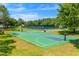 Community basketball court with tennis courts in background at 10160 Mallard Landings Way, Orlando, FL 32832