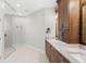 Bathroom featuring double vanity with marble countertops and a tiled shower at 10160 Mallard Landings Way, Orlando, FL 32832