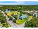 Aerial view of the community amenities including tennis courts, baseball field, pool, and playground at 10160 Mallard Landings Way, Orlando, FL 32832