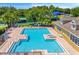Community pool with zero entry, sun loungers, and cabana at 10160 Mallard Landings Way, Orlando, FL 32832