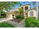 Stunning two-story home features a lush lawn, beautiful landscaping, and a two car garage at 10160 Mallard Landings Way, Orlando, FL 32832