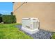 Generac generator on a bed of black rocks in a green lawn near the home at 10160 Mallard Landings Way, Orlando, FL 32832
