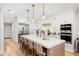 Spacious kitchen with modern appliances, a large island with seating, and open floor plan at 10160 Mallard Landings Way, Orlando, FL 32832