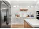 Modern kitchen with stainless steel appliances, white cabinets, and sleek countertops at 10160 Mallard Landings Way, Orlando, FL 32832