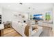 Bright living room features an oversized sectional, hardwood floors and sunny windows at 10160 Mallard Landings Way, Orlando, FL 32832
