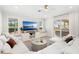 Bright living room with large windows, comfortable seating, and a view of the outdoor space at 10160 Mallard Landings Way, Orlando, FL 32832