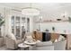 Relaxing living room area with a bar, natural light, and comfortable seating arrangements at 10160 Mallard Landings Way, Orlando, FL 32832