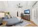 Spacious main bedroom features a wooden bed frame, and gray toned dressers at 10160 Mallard Landings Way, Orlando, FL 32832