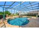 Inviting screened-in pool with a clear blue water, a hot tub, and a spacious deck area at 10160 Mallard Landings Way, Orlando, FL 32832