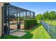View of the outdoor pool and deck surrounded by a screen enclosure and lush landscaping at 10160 Mallard Landings Way, Orlando, FL 32832